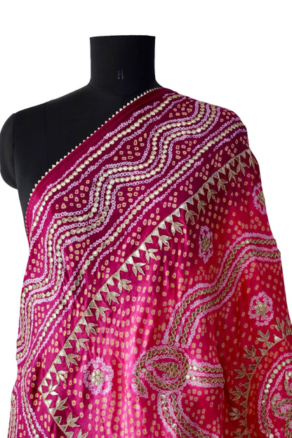 Bright pink Bandhani dupatta with a contrasting burgundy border