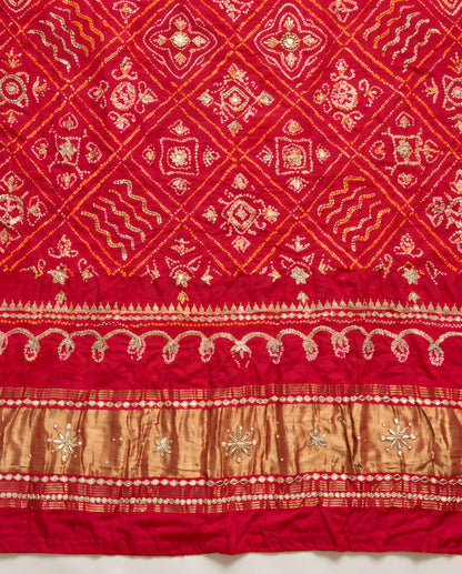 Border detailing on ruby red Bandhani gota patti dupatta