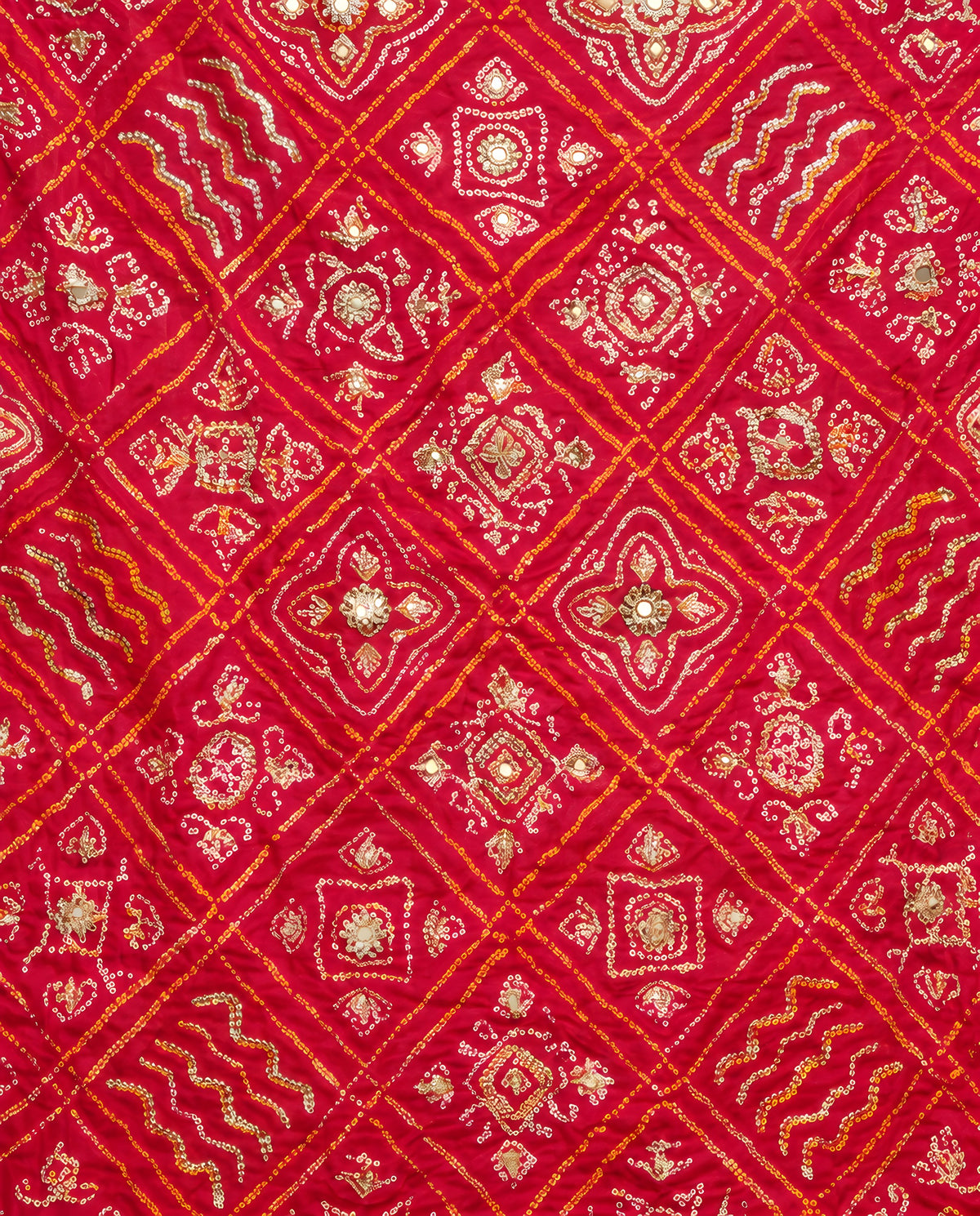 Close-up of gota patti work on ruby red Bandhani dupatta