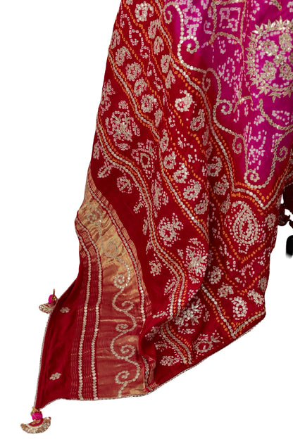 Circular floral Gota Patti medallions surrounded by curling Bandhani patterns on pink silk