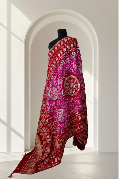 Velvet Rose pink and red Gajji silk Bandhani dupatta draped on a black mannequin
