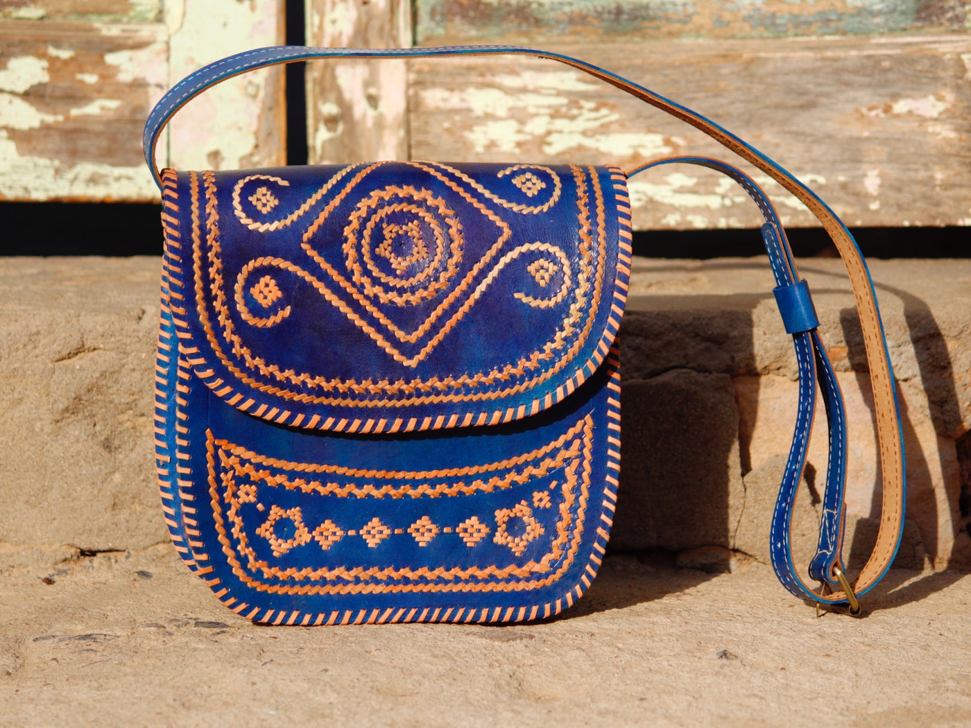 Elegant leather bag with embroidered accents and durable leather construction